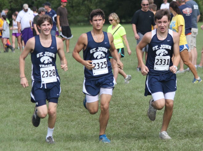 St. John's Christopher Patin, Mason LeBlanc and Colby Sadden compete in the St. Joseph Academy Cross Country Invitational earlier in the season. St. John competed in the Walker Shootout on Saturday. 
POST SOUTH PHOTO/Peter Silas Pasqua