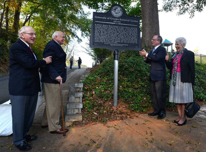Vince Dooley, from left, Hubert McAlexander, Todd Groce and Mayor Nancy Denson unveil a historical marker that notes the area as the site of the former University of Georgia Botanical Gardens on Tuesday, Oct. 29, 2013, in Athens, Ga.  (Richard Hamm/Staff) OnlineAthens / Athens Banner-Herald