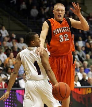 Dalton Pepper (right) loses the ball as he drives the lane while being guarded by Penn Woods Tyree Johnson (left) during the fourth quarter of Pennsbury's loss to Penn Wood in the PIAA AAAA quarterfinals at Villanova, March 14, 2009.