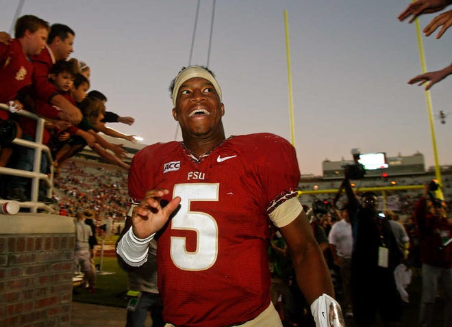 Florida State quarterback Jameis Winston (5) reacts to fans as he leaves Doak Campbell stadium after an NCAA college football game against North Carolina State, Saturday, Oct. 26, 2013, in Tallahassee, Fla. Florida State won 49-17. (AP Photo/Phil Sears)