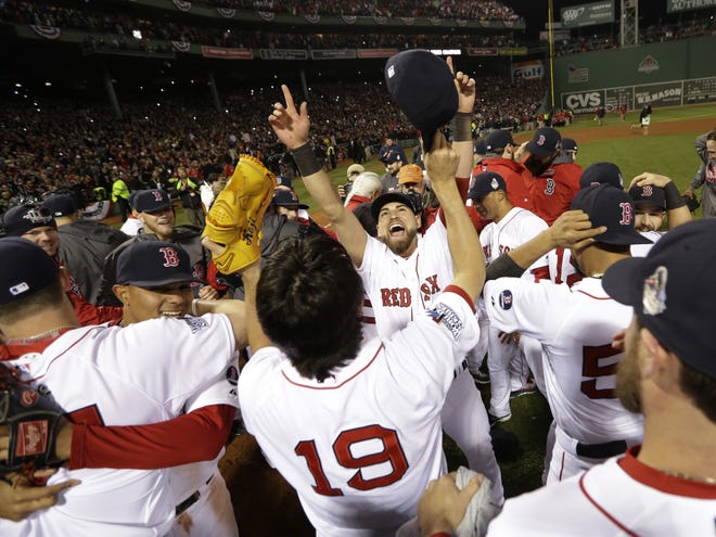 The Boston Red Sox celebrate after defeating the St. Louis Cardinals in Game 6 of baseball's World Series Wednesday in Boston. The Red Sox won 6-1 to win the series.