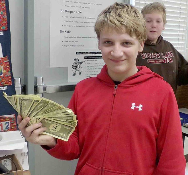 Tyler Warner shows how much he has earned in classroom money.

Courtesy photo