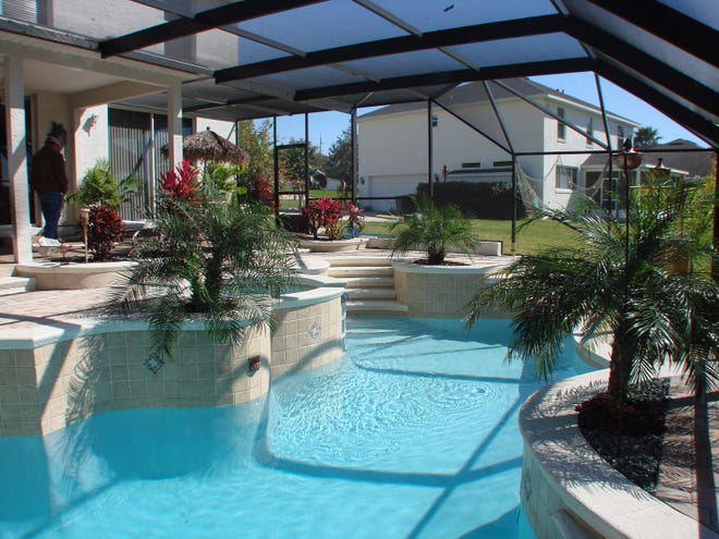 This Deltona pool features multiple planters.