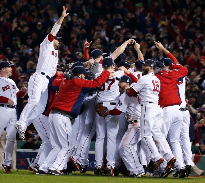 The Red Sox celebrate after beating the Cardinals 6-1 in Game 6 to win the World Series on Wednesday night at Fenway Park. It was the franchise's third championship in 10 seasons, but the first the Red Sox won at home since 1918.