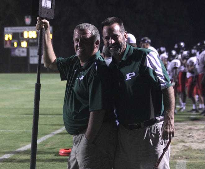 Iberville Parish councilmen Louis “Pete” Kelly and Edwin M. Reeves pause during the Plaquemine – Brusly football game earlier in the season while volunteering to work on the chain crew.
POST SOUTH PHOTO/Peter Silas Pasqua