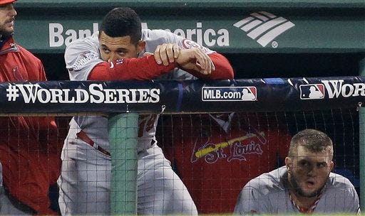 St. Louis Cardinals' Jon Jay watches from the dugout during the seventh inning of Game 6 of baseball's World Series against the Boston Red Sox Wednesday, Oct. 30, 2013, in Boston. (AP Photo/David J. Phillip)