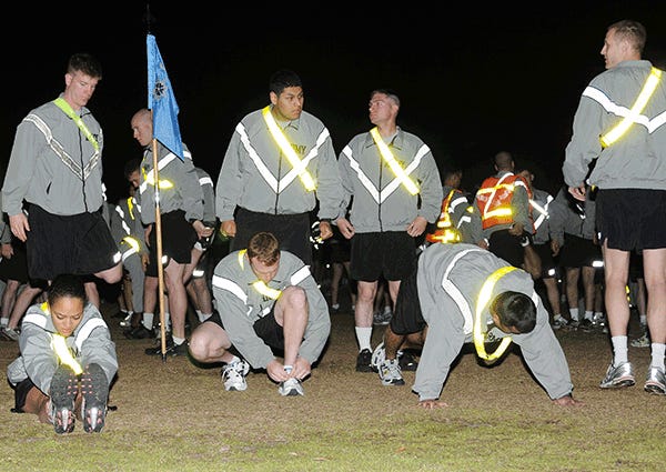 Soldiers of the 525th Battlefield Surveillance Brigade stretch before they begin a four-mile run before the sun comes up March 16, 2010. The run marked the beginning of the unit’s first Brigade Organizational Day, which was celebrated to recognize the unit’s one-year anniversary since becoming the Army’s first battlefield surveillance brigade.