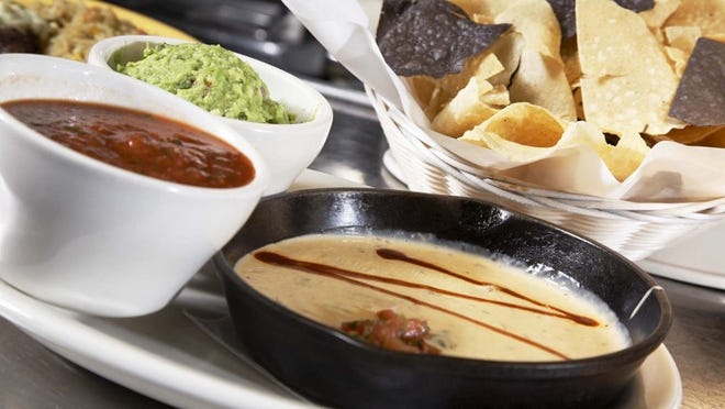 Z’Tejas is home to a blend of Southwestern flavors in its signature dishes, including the Tejas Trio with queso, guacamole and salsa.