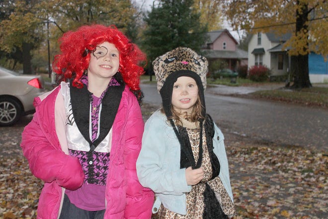 Emily and Cherokee Teeples trick-or-treat in Coldwater Thursday.

Christy Hart-Harris photo