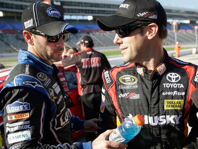 Jimmie Johnson, left, playfully interrupts Matt Kenseth as Kenseth gives an interview on Friday during qualifying for Sunday's NASCAR Sprint Cup race at Texas Motor Speedway.