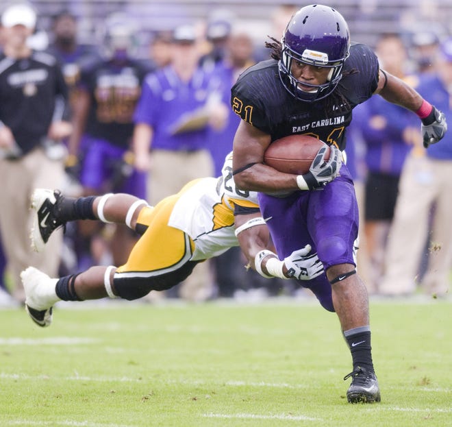 ECU running back Vintavious Cooper breaks a tackle in ECU’s 55-14 win over Southern Mississippi two weeks ago in Greenville. The Pirates travel to Florida International Saturday.