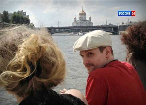 In this video frame grab provided by LifeNews via Rossia 24 TV channel, which has been authenticated based on its contents and other AP reporting, former National Security Agency systems analyst Edward Snowden looks over his shoulder during a boat trip on the Moscow River in Moscow, with the Christ the Savior Cathedral in the background. LifeNews said the video was shot in September and Snowden's lawyer, Anatoly Kucherena, confirmed the photo's authenticity. Snowden is calling for international help to persuade the U.S. to drop its espionage charges against him, according to a letter a German lawmaker released Friday after he met the American in Moscow.