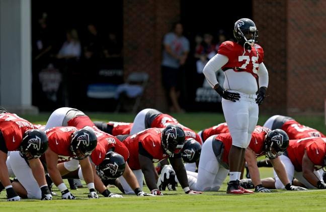 Falcons offensive lineman and Hunter Huss graduate Lamar Holmes, right, stands during a drill in training camp at the team's practice facility on July 30, 2013, in Flowery Branch, Ga. 


Image Description - Atlanta Falcons' Lamar Holmes, right, stands during a drill in training camp at the NFL football team's practice facility, Tuesday, July 30, 2013, in Flowery Branch, Ga. (AP Photo/David Goldman)