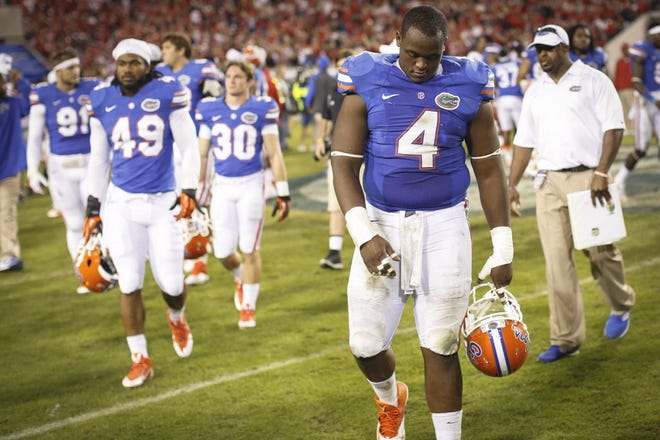 Florida Gators defensive lineman Damien Jacobs (4) walks off the field following the Gators' 23-20 loss against the Georgia Bulldogs on November 02, 2013 at EverBank Field in Jacksonville Fla. (Rob C. Witzel/Staff photographer)