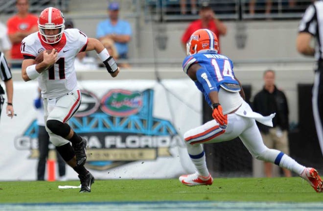 Kelly Jordan For the Times-Union Georgia quarterback Aaron Murray scrambles for 17 yards in the first quarter of the Bulldogs' 23-20 win over Florida on Saturday at EverBank Field.