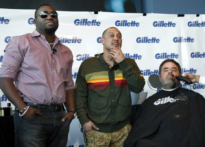 Elise Amendola Associated Press Boston Police Officer Steve Horgan is shaved as Red Sox players David Ortiz (left) and Shane Victorino relax after their shave-off Monday for One Fund Boston, the Boston Marathon charity for bombing victims.