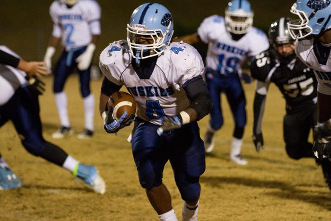 Hunter Huss' Kerrion Moore runs with the ball against Forestview on Monday night.