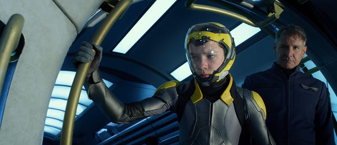 Ender Wiggin (Asa Butterfield) prepares to go weightless as his mentor Colonel Graff (Harrison Ford) looks on approvingly.
