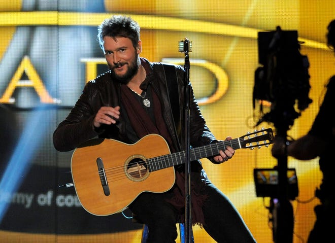 In this April 7, 2013, photo, singer Eric Church performs at the 48th Annual Academy of Country Music Awards at the MGM Grand Garden Arena in Las Vegas. Church will be playing his new single, the hard rock anthem "The Outsiders," on Wednesday night, Nov. 6, 2013, during the Country Music Association Awards.