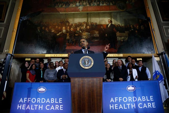 FILE - In this Oct. 30, 2013 file photo, President Barack Obama speaks at Boston's historic Faneuil Hall about the federal health care law. Now is when Americans start figuring out that President Barack Obama's health care law goes beyond political talk, and really does affect them and people they know. With a cranky federal website complicating access to new coverage and some consumers being notified their existing plans are going away, the potential for winners and losers is creating anxiety and confusion. A look at three broad groups: those losing coverage, those gaining coverage, and those wondering if their coverage will change. (AP Photo/Charles Dharapak, File)