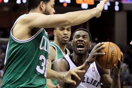 The Celtics' Vitor Faverani (left) and Courtney Lee (center) defend against the Grizzlies' Tony Allen (right) in the second half of Monday's game.