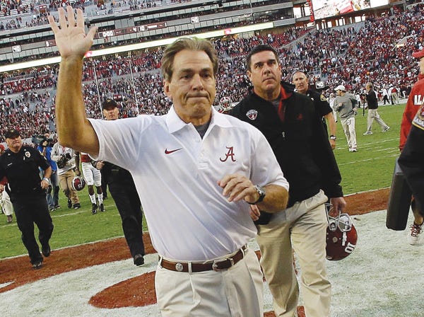 Alabama coach Nick Saban waves to the crowd after a 45-10 win over Tennessee on Oct. 26. (Dave Martin | Associated Press)