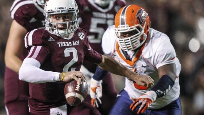 A&M quarterback Johnny Manziel, rushing against Texas-El Paso last week, will be eligible for the NFL draft after this season, as will his favorite receiving target, Mike Evans. (Troy Taormina/USA Today Sports)