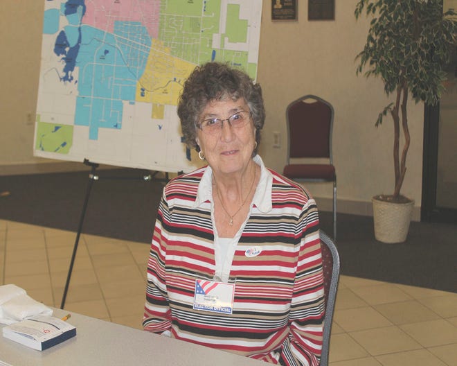 Grace Houtz greeted and assisted voters as they entered the Dearth Center.