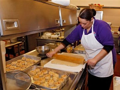 Alexes Garcia makes cinnamon rolls for student's lunch in the kitchen at Kepner Middle School in Denver. The rolls are made using apple sauce instead of trans fats. Heart-clogging trans fats have been slowly disappearing from grocery aisles and restaurant menus in the last decade as nutritionists have criticized them and local governments have banned them.