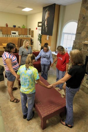 (Photo by Mike Hensdill/The Gaston Gazette) The Gastonia Potter's House, on Burmil Road in Ranlo, a nonprofit that helps women overcome drug addiction, is facing foreclosure. Here, residents along with director Cindy Marshall form a prayer circle to pray for Potter's House Monday afternoon, Sept. 16, 2013.
(Photo by Mike Hensdill/The Gaston Gazette) The Gastonia Potter's House, on Burmill Road in Ranlo, a nonprofit that helps women overcome drug addiction, is facing foreclosure. Here, residents along with director Cindy Marshall form a prayer circle to pray for Potter's House Monday afternoon, September 16, 2013.