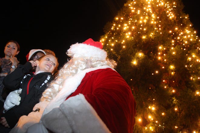 Fernando Nunez, 4, sits on Santa's lap during the Children's Christmas Tree Lighting ceremony in Kings Mountian last year. (Ben Earp/The Star)