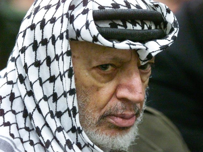 In this May 31, 2002 file photo, Palestinian leader Yasser Arafat pauses during the weekly Muslim Friday prayers in his headquarters in the West Bank city of Ramallah. Al-Jazeera is reporting that a team of Swiss scientists has found moderate evidence that longtime Palestinian leader Arafat died of poisoning.