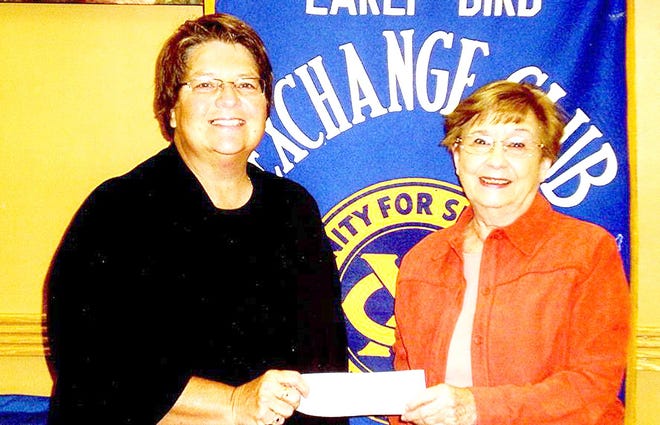 Lown, left, accepts the donation for the Branch Area Food Pantry from Morrill. Courtesy photo