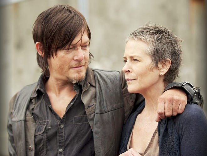 Daryl Dixon appears as Norman Reedus and Carol Peletier as Melissa McBride in AMC's "The Walking Dead."