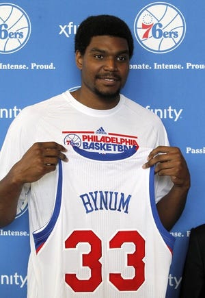 Andrew Bynum with his new 76ers jersey, when hopes were still high (courtesy Philadelphia 76ers).