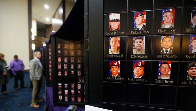 A memorial to Texans lost in Iraq and Afghanistan was on display during the invitation-only Purple Heart Banquet on Friday at the Lubbock Memorial Civic Center.