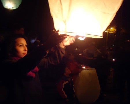 Angie Birdsall/Special to the Journal
Jennifer Grover lights a sky lantern and sets it aloft at a vigil held Friday to mark the sixth anniversary of the death of Jodi Parrack. Investigation into the homicide continues.