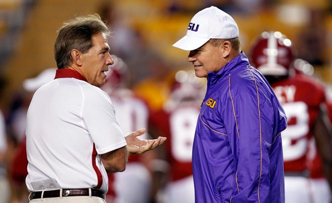 Alabama head coach Nick Saban (left) and LSU head coach Les Miles greet each other prior to last season's game in Baton Rouge.