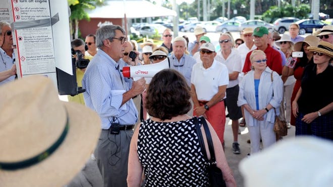 Councilman Michael J. Pucillo leads the tour Friday of the Royal Poinciana Way district that is part of the proposed PUD-5. It was hosted by the Palm Beach Civic Association.