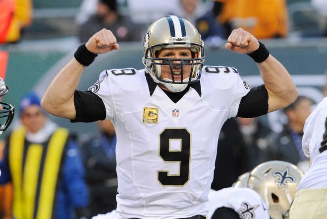 New Orleans Saints quarterback Drew Brees signals during the second half of an NFL football game against the New York Jets Sunday, Nov. 3, 2013, in East Rutherford, N.J. (AP Photo/Bill Kostroun)
