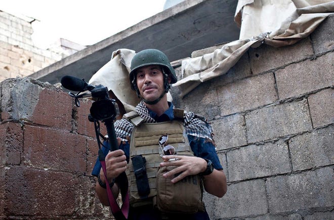 FILE - In this November 2012, file photo, posted on the website freejamesfoley.org, shows missing journalist James Foley while covering the civil war in Aleppo, Syria. American freelance journalist Foley disappeared in November 2012. Behind a veil of secrecy, at least 30 journalists have been kidnapped or have disappeared in Syria - held and threatened with death by extremists or taken captive by gangs seeking ransom. (AP Photo/Nicole Tung, freejamesfoley.org, File) NO SALES
