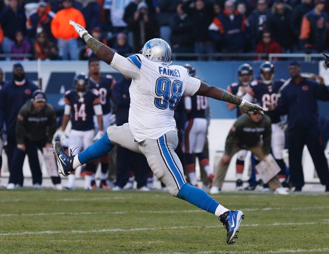 Detroit Lions defensive tackle Nick Fairley (98) celebrates after making a tackle against Chicago Bears during the second half Sunday in Chicago. (AP Photo/Charles Rex Arbogast)