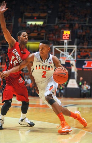 Illinois guard Joseph Bertrand (2) drives past Jacksonville State guard Grant White during the first half of an NCAA college basketball game Sunday, Nov. 10, 2013, in Champaign, Ill. (AP Photo/Rick Danzl)