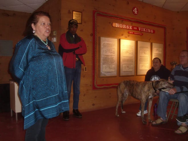 Suzanne Blake, sub-chief of the Assonet Band of the Wampanoag Nation, gives a presentation, answering questions at Dighton Rock Museum in Berkley on Sunday. Kenny Alves, center, chief of the Assonet Band of the Wampanoag Nation, also spoke during the event.