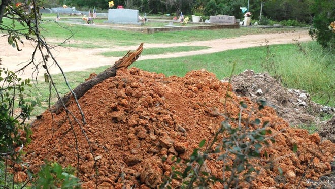 A load of road base left over from road construction will be used at Oak Hill Cemetery to make room for more gravesites.