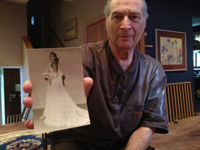 Dave Derringer of Cherry Hill holds the photograph of his late wife, Elaine, which was used by artist Ralph Cowan to paint the official portrait of Princess Grace of Monaco in 1956.