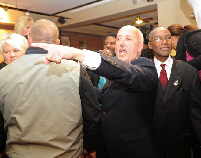 Brockton mayor-elect Bill Carpenter is mobbed by supporters during a victory party at Joe Angelo's Cafe in Brockton on Tuesday, Nov. 5, 2013.