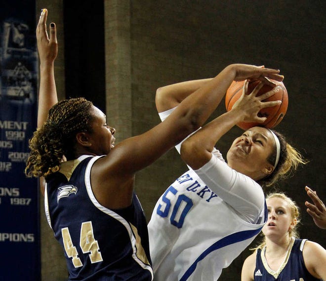 Kentucky's Azia Bishop (50) shoots under pressure from Georgia Southern's Jessica Marcus (44) on Wednesday in Lexington, Ky. Kentucky won 103-38.