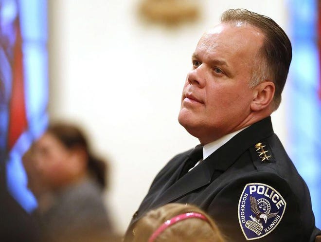 Police Chief Chet Epperson listens as Chaplain Louisett Ness leads the congregation at the northern Illinois police memorial service Thursday, May 16, 2013, at Emmanuel Episcopal Church in Rockford.