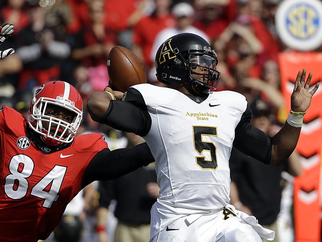 Georgia’s Leonard Floyd, left, closes in on Appalachian State quarterback Kameron Bryant during last week's game. The Mountaineers hung tough with Georgia for most of the game. It was 17-6 late in the third quarter before Georgia pulled away for a 45-6 win.